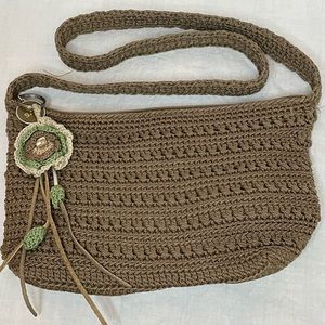 The Sak Crochet Shoulder Bag in Cognac color. Crochet Flower detail on zipper.